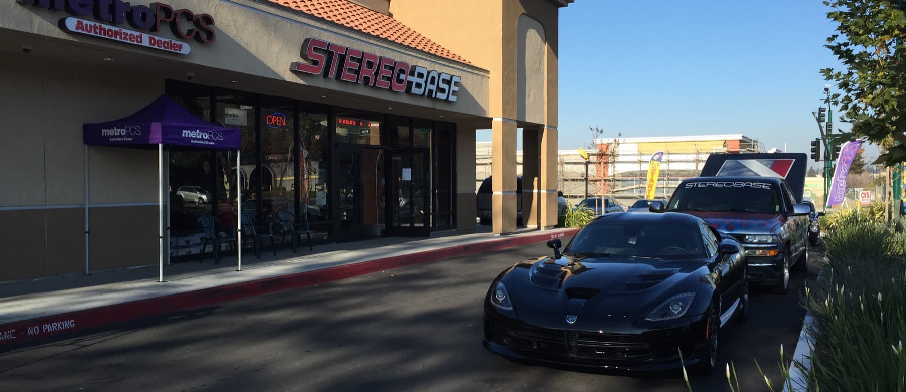 Stereo Base storefront on Mission Blvd with a Dodge Viper parked outside